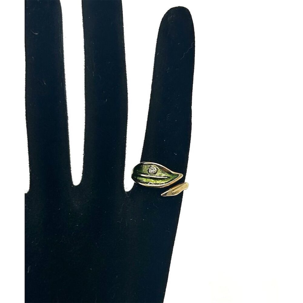 Vintage Avon gold tone wrap ring with green enamel leaf and rhinestone Size 7.5